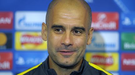 Pep Guardiola, l'entraîneur de Manchester City, en conférence de presse. (ANDY BUCHANAN / AFP)