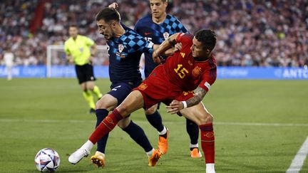 Croatian Mario Pasalic (left) against Spaniard Yeremy Pino in the Nations League final, in Rotterdam (Netherlands), June 18, 2023. (MAURICE VAN STEEN / ANP MAG via AFP)