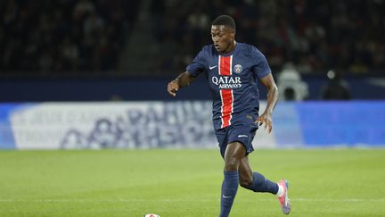 Nuno Mendes lors du match de Ligue 1 entre le PSG et Brest, au Parc des Princes, le 14 septembre 2024. (GEOFFROY VAN DER HASSELT / AFP)