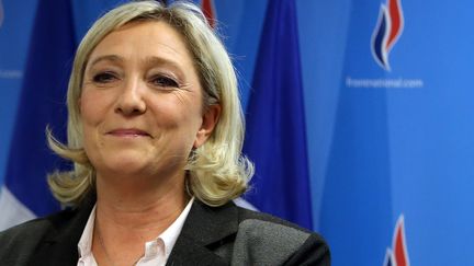 Marine Le Pen, la pr&eacute;sidente du Front national, le 30 mars 2014 &agrave; Nanterre (Hauts-de-Seine). (KENZO TRIBOUILLARD / AFP)