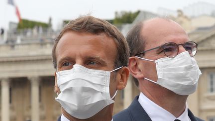 Emmanuel Macron (à gauche) et le Premier ministre Jean Castex lors du&nbsp;14 juillet 2020 à Paris. Photo d'illustration. (LUDOVIC MARIN / POOL / AFP)