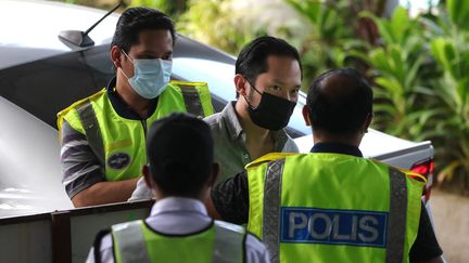 Chan Eu Boon, le fondateur de Sugar Book, arrive dans un tribunal près de Kuala Lumpur (Malaisie), le 24 février 2021 (FAHMI DAUD / AFP)