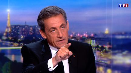 L'ancien président de la République, Nicolas Sarkozy, sur le plateau du journal de 20 heures de TF1, le 22 mars 2018. (TF1 / AFP)