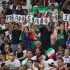 Des supporters iraniens brandissent des lettres formant le nom de Mahsa Amini lors du match contre les Etats-Unis en Coupe du monde, le 29 novembre 2022, au stade Al-Thumama au Qatar. (VIRGINIE LEFOUR / AFP)