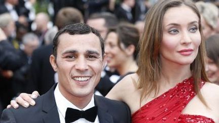 Brahim Asloum et l'actrice italienne Isabella Orsini à Cannes le 19 mai 2013
 (VALERY HACHE / AFP)