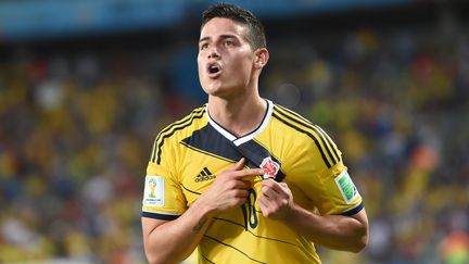 Le Colombien James Rodriguez c&eacute;l&egrave;bre un de ses buts contre la Cor&eacute;e du Sud, le 24 juin 2014, &agrave; Cuiaba (Br&eacute;sil). (TOSHIFUMI KITAMURA / AFP)