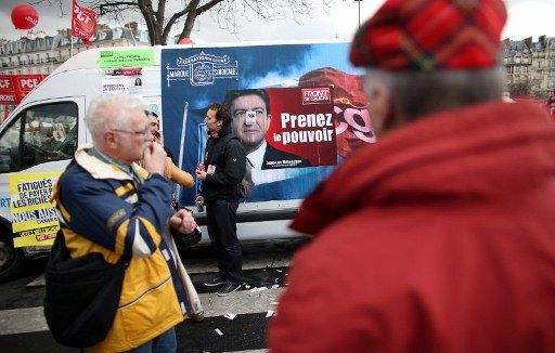 Jean-luc Mélenchon à l'affiche d'un meeting, à la Bastiile, Paris, le 18 mars 2012. (Afp)