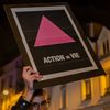 Une affiche de l'association Act Up-Paris lors d'une manifestation le 1er janvier 2021 à Paris, à l'occasion de la Journée mondiale de lutte contre le sida. (SOPHIE LIBERMANN / HANS LUCAS / AFP)