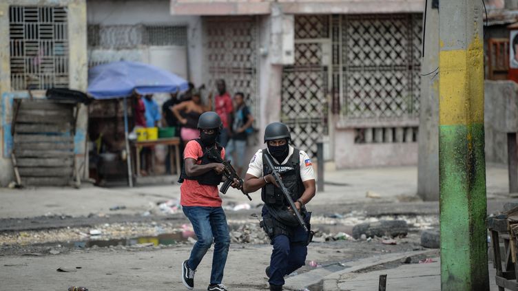 Police officers patrol a neighborhood amid gang-related violence in central Port-au-Prince, Haiti, on April 25, 2023. (RICHARD PIERRIN / AFP)