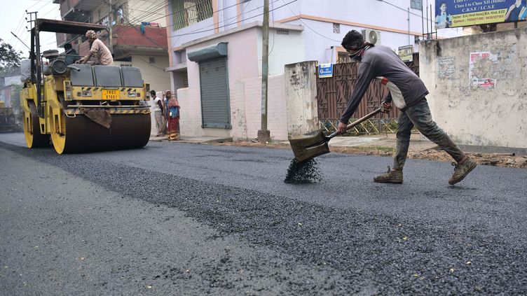 Workers build a road using plastic waste in the town of Agartala in the state of Tripura, on January 29, 2021. (ABHISEK SAHA / LE PICTORIUM / MAXPPP)