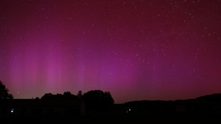 An aurora borealis visible from Auterrive, in the Pyrénées-Atlantiques, on May 11, 2024. (SEBASTIEN LAPEYRERE / HANS LUCAS / AFP)