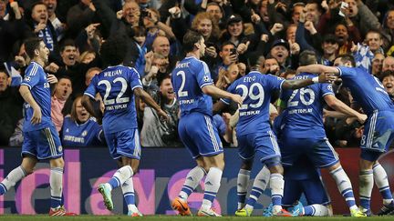 La joie des Blues après leur qualification pour les quarts de finale de la C1 (ADRIAN DENNIS / AFP)