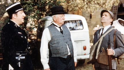 Pierre Tornade (&agrave; gauche), aux c&ocirc;t&eacute;s de Jean Gabin et Louis de Fun&egrave;s dans "Le Tatou&eacute;" de Denys de La Patelli&egrave;re&nbsp;(1968). (MARCEL DOLE / AFP)