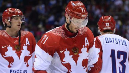 Les joueurs de la Russie (Alexander Ovetchkine, Ilya Kovalchuck et Pavel Datsyuk) têtes basses