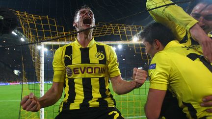 La joie du joueur du Borussia Dortmund Lukasz Piszczek apr&egrave;s la qualification &agrave; l'arrach&eacute; de son &eacute;quipe contre Malaga, en quarts de finale de la Ligue des champions, le 9 avril 2013. (ALEX GRIMM / GETTY IMAGES)