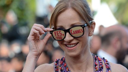 Nous sommes en 2012 et la fameuse blague "Yes You Cannes" fait toujours rire la Croisette. Les m&ecirc;mes qui disent "J'peux pas j'ai piscine" probablement... (ANNE-CHRISTINE POUJOULAT / AFP)