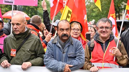 Le secrétaire général de la CGT, Philippe Martinez, en tête de cortège (au centre) lors de la manifestation contre la réforme des retraites à Paris, mardi 24 septembre 2019. (MUSTAFA YALCIN / AFP)