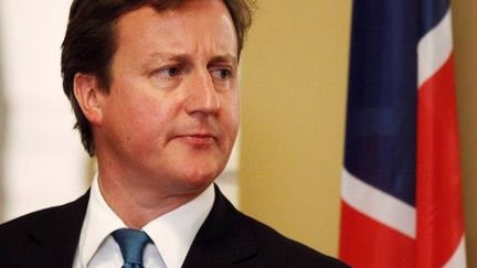 David Cameron, ici à Lagos, a écourté un voyage en Afrique pour être entendu par les députés (19 juillet 2011) (AFP / Christopher Furlong)