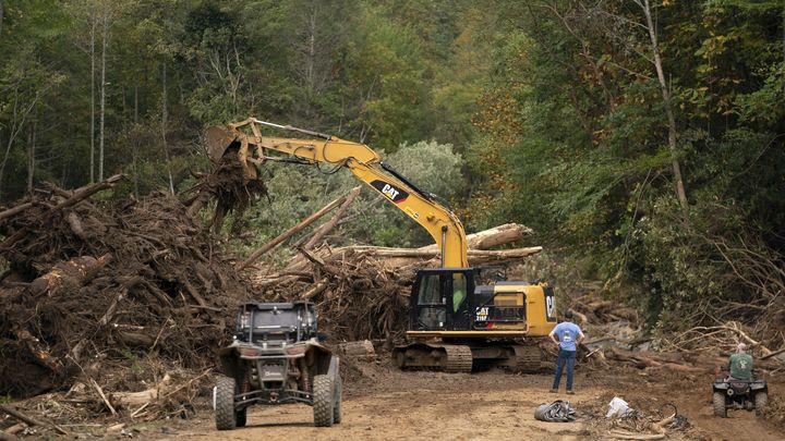 Equipment tries to clear a road devastated by storm Helene, September 30, 2024, near Fairview, North Carolina. (SEAN RAYFORD/GETTY IMAGES NORTH AMERICA)