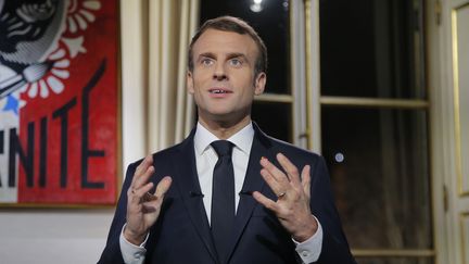 Emmanuel Macron, lors de ses voeux aux Français, le 31 décembre. (MICHEL EULER / POOL / AFP)