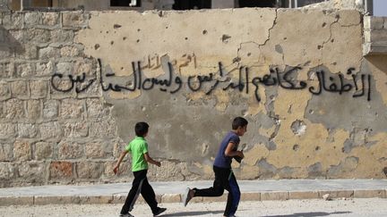 Des enfants dans la ville d'Idlib, en Syrie, en mai 2016. &nbsp; (KHALIL ASHAWI / REUTERS / X03676)