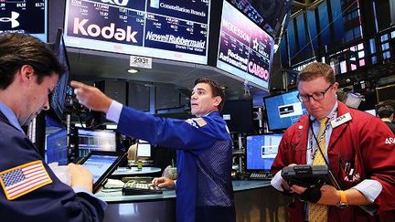 Des traders du New York Stock exchange (NYSE), le 6 juillet 2015. (AFP)