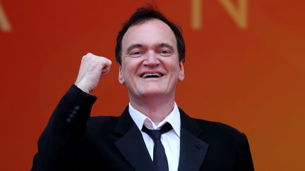 Le réalisateur Quentin Tarantino est venu soutenir son concurrent Dio Yinan à la projection du Lac aux oies sauvages. Son film Once Upon a Time ... In Hollywood, est également en lice pour la Palme et sera présenté le 21 mai.&nbsp; (VALERY HACHE / AFP)