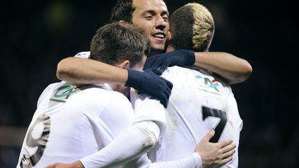 De gauche &agrave; droite, les joueurs du PSG Kevin Gameiro, Nene et Jeremy Menez, c&eacute;l&egrave;brent l'un des quatre buts incrits face &agrave; Sabl&eacute;-sur-Sarthe (CFA2), &nbsp;sur la pelouse du MMArena du Mans, le 20 janvier 2012. (DAMIEN MEYER / AFP)