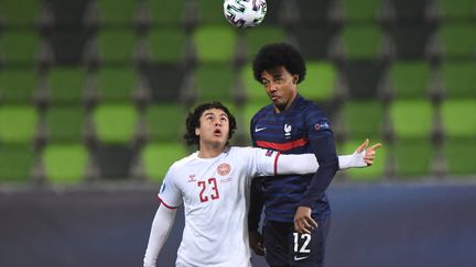 Jules Koundé face au Danemark (ATTILA KISBENEDEK / AFP)