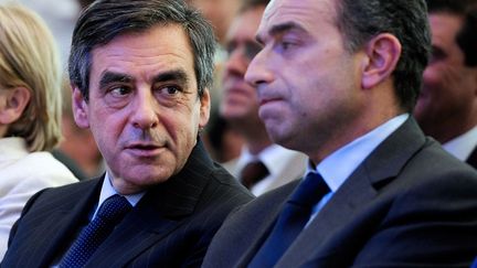 Lutte fratricide pour la tête de l'UMP entre MM. Fillon et Copé. (JEAN-PIERRE MULLER / AFP)