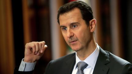 Bachar Al-Assad, le 19 janvier 2014, lors d'un entretien avec l'AFP, au palais pr&eacute;sidentiel syrien, &agrave; Damas. (JOSEPH EID / AFP)