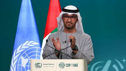 COP28 President Sultan Ahmed Al Jaber applauds during the plenary session at the United Nations climate summit in Dubai, December 13, 2023. (GIUSEPPE CACACE / AFP)