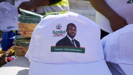 A cap bearing the image of Senegalese opponent Ousmane Sonko, in Paris, August 12, 2023. (ADNAN FARZAT / NURPHOTO / AFP)