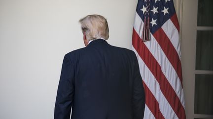 Le président américain Donald Trump regagnant la Maison Blanche à Washington (Etats-Uni), après l'annonce du retrait américain de l'accord de Paris sur le climat, le 1er juin 2017. (CHERISS MAY / NURPHOTO / AFP)