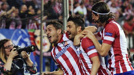 Les joueurs de l'Atletico Madrid Koke, David Villa et Filipe Luiz