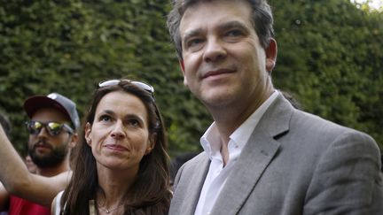 Aur&eacute;lie Filippetti (&agrave; gauche) et Arnaud Montebourg (&agrave; droite), le 21 juin 2014 &agrave; Paris. (KENZO TRIBOUILLARD / AFP)