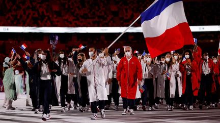 La délégation française lors de la cérémonie d'ouverture des JO à Tokyo, le 23 juillet 2021.&nbsp; (Odd ANDERSEN / AFP)