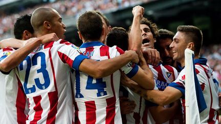 Les joueurs de l'Atletico Madrid fêtent leur victoire face au Real (DANI POZO / AFP)