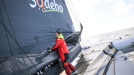 Thomas Coville à bord du Sodebo Ultim 3, à Lorient, le 22 novembre 2024. (SEBASTIEN SALOM-GOMIS / AFP)