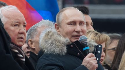 Vladimir Poutine lors d'un meeting organisé le 3 mars 2018 au stade olympique de Moscou (Russie). (SERGEY GUNEEV / SPUTNIK / AFP)