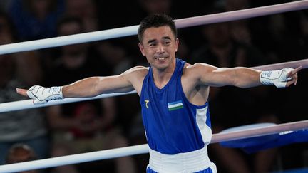 Hasanboy Dusmatov crowned Olympic champion in the -51 kg boxing tournament, at the Paris Olympics, on August 8, 2024. (MUSTAFA CIFTCI / ANADOLU / AFP)