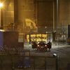 Des gendarmes font face à des militants de Greenpeace qui se sont introduits dans la centrale nucléaire de Cattenom (Moselle), le 12 octobre 2017. (ALEXANDRE MARCHI / MAXPPP)