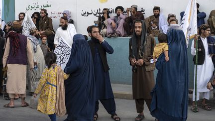 Afghan women near Ahmad Shah Massoud Square in Kabul on August 14, 2024. (WAKIL KOHSAR / AFP)