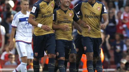 La joie des joueurs d'Arsenal, faciles vainqueurs des Lyonnais (IAN KINGTON / AFP)