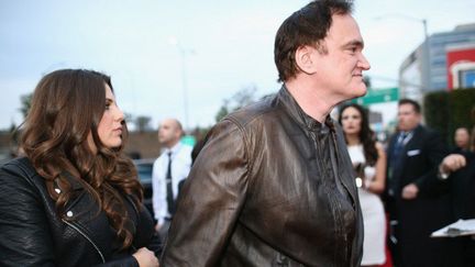 Quentin Tarantino arrive avec une invitée aux Grammys Awards, le 26 janvier 2014, au Staples Center de Los Angeles
 (Christopher Polk / GETTY IMAGES NORTH AMERICA / AFP)