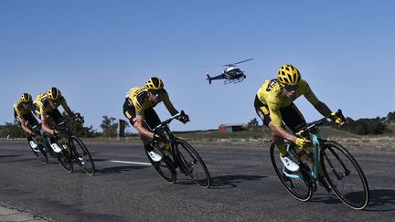 Un hélicoptère filme la 14e étape du Tour de France 2020, le 12 septembre 2020. (MARCO BERTORELLO / AFP)