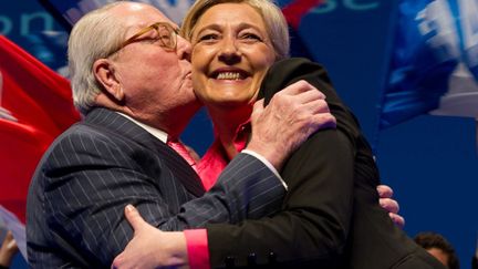 J-37 Le pr&eacute;sident d'honneur du Front national, Jean-Marie Le Pen embrasse sa fille Marine en meeting &agrave; Nice (Alpes-Maritimes), le 30 mars 2012. (CHAMUSSY / SIPA)