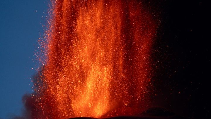 Lava erupts from a crater of Mount Etna volcano early on August 4, 2024 in Sicily. (GIUSEPPE DISTEFANO / ETNA WALK / AFP)