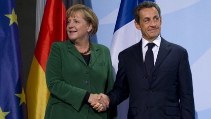 Nicolas Sarkozy et Angela Merkel, le 9 octobre 2011 à Berlin. (JOHANNES EISELE / AFP)