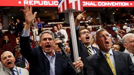 Des délégués républicains lors de la convetion républicaine, à Cleveland (Etats-Unis), le 18 juillet 2016. (JOHN MOORE / GETTY IMAGES NORTH AMERICA / AFP)